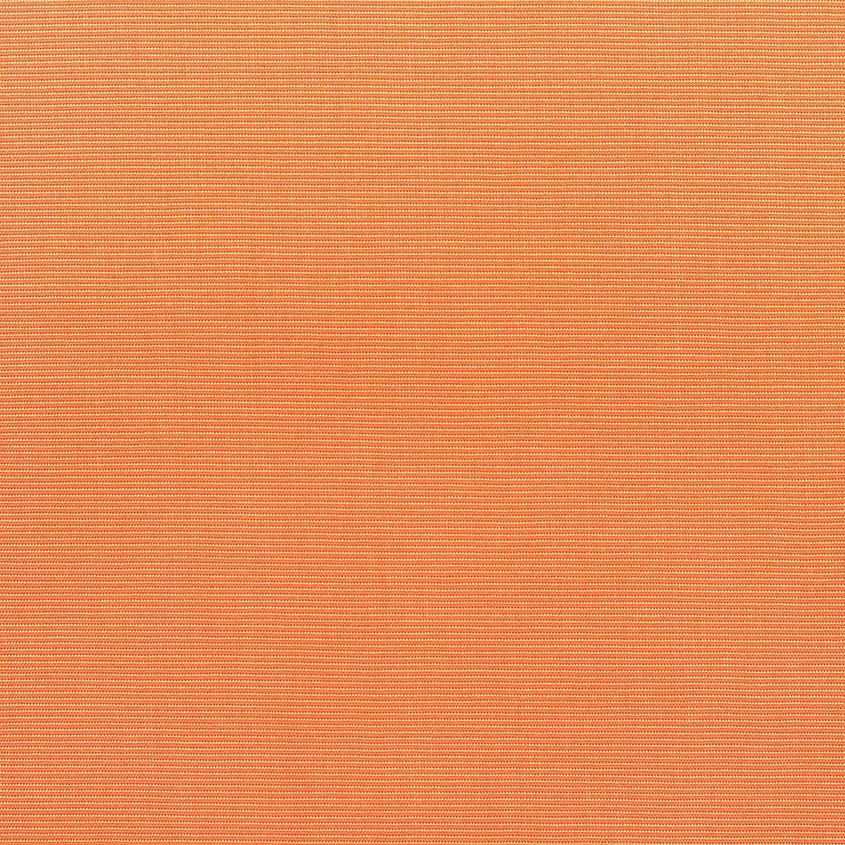 A close up of a piece of orange fabric with a pattern.