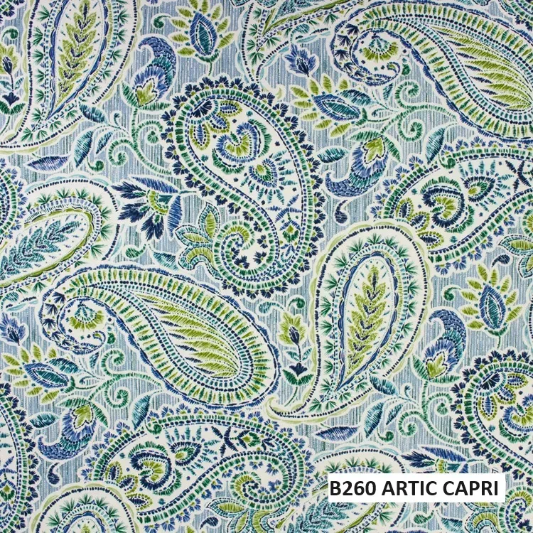 A close up of a paisley pattern on a fabric.