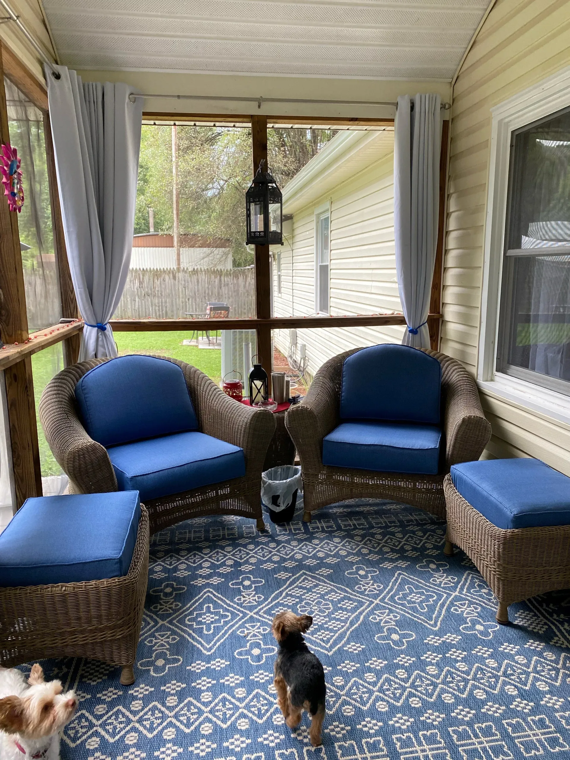 Custom patio furniture with royal blue covers.