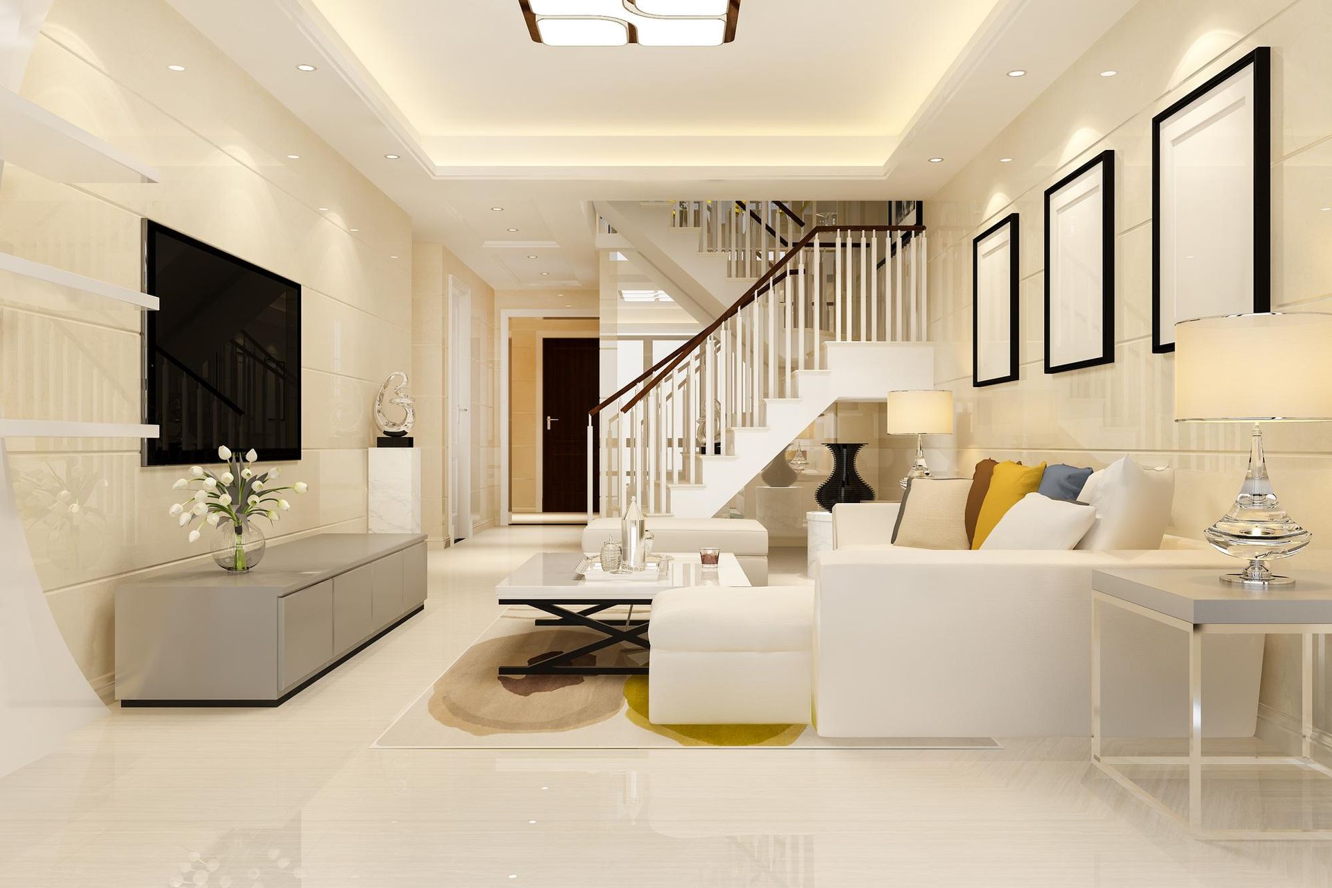Modern living room with white walls, stairs, and a sectional sofa.