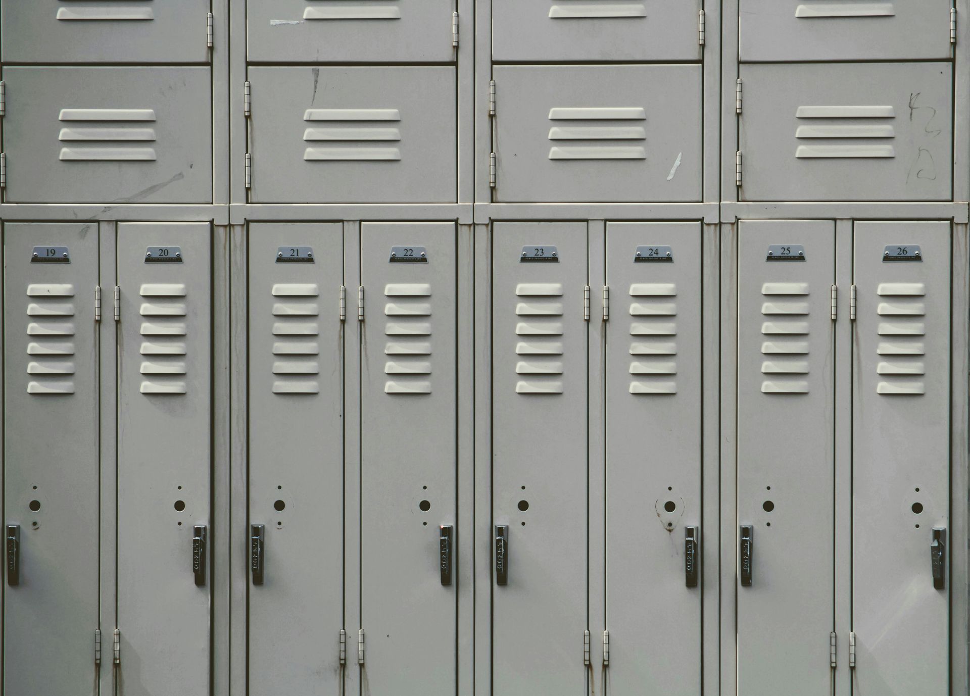 Row of light gray metal school lockers.