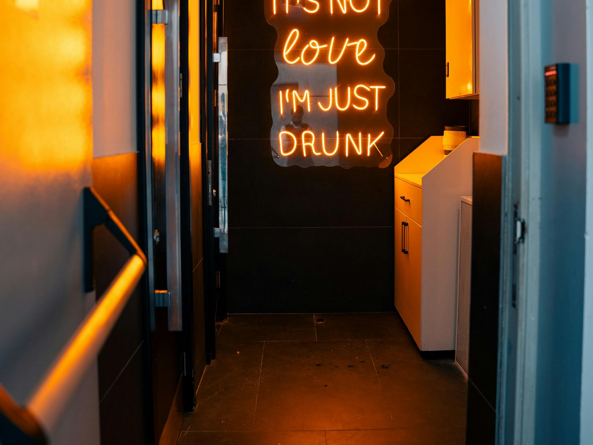 Dark hallway with neon sign