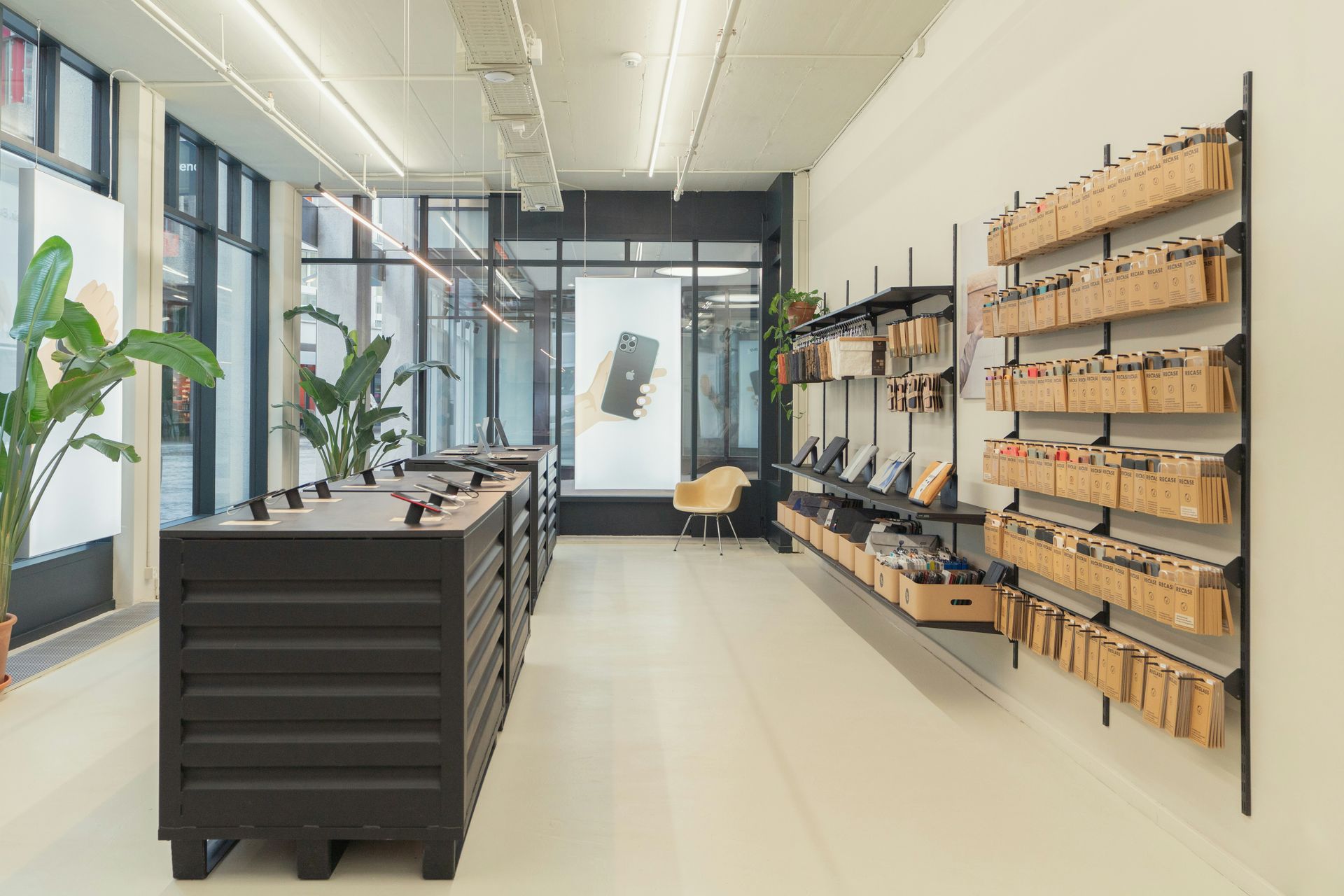 Modern retail store interior with display shelves and product displays.
