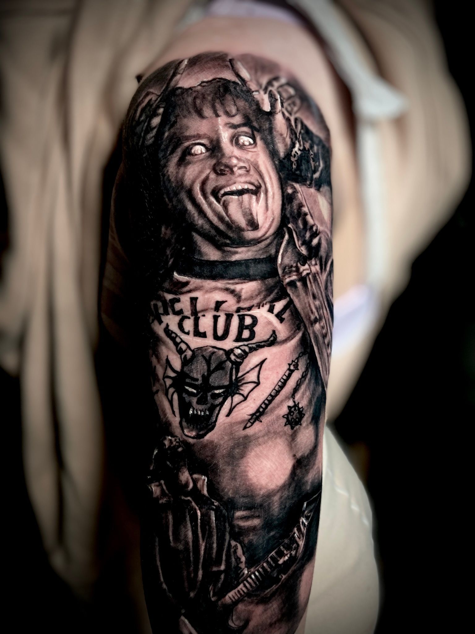 Tattoo of a man with tongue out, 