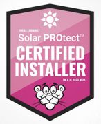 a pink badge that says solar protect certified installer | Millsboro, DE | Alpha Roofing & Siding