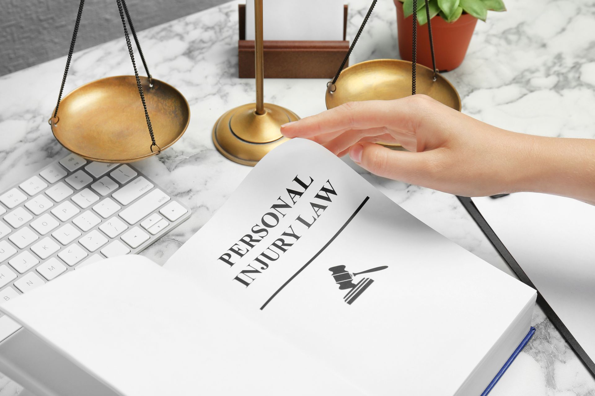 Personal injury attorney flipping through a Personal Injury Law book