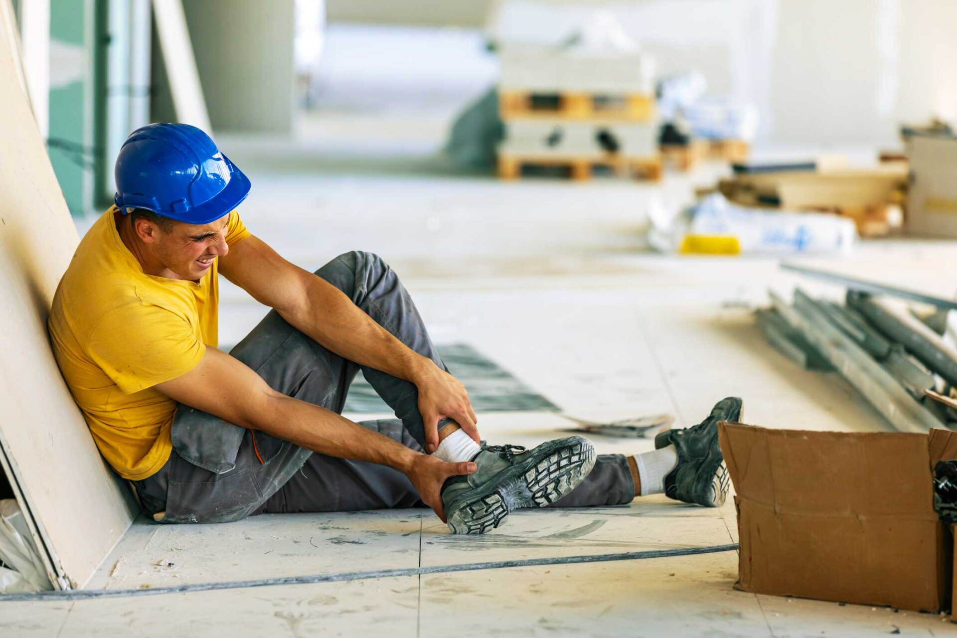 Man holding his injured foot — Wilmington, DE — Daniel D. Martin & Associates, LLC