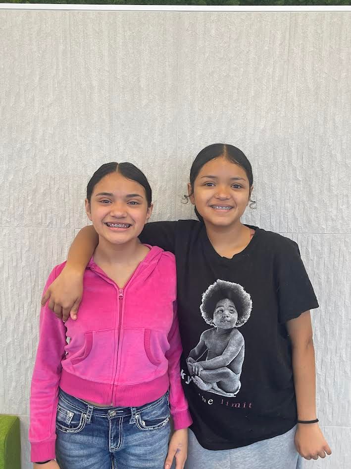 two sisters smiling after orthodontic appointment