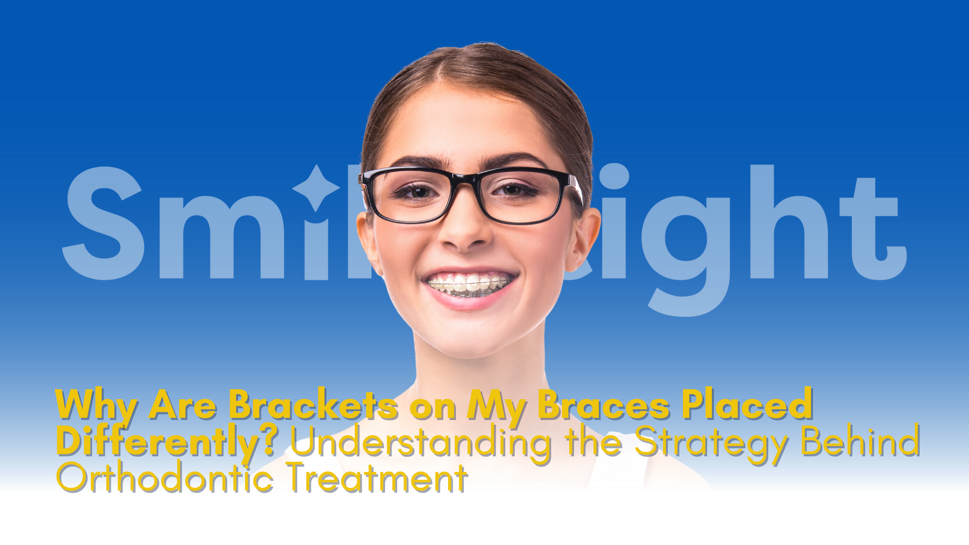 A woman wearing glasses is smiling in front of a blue background.
