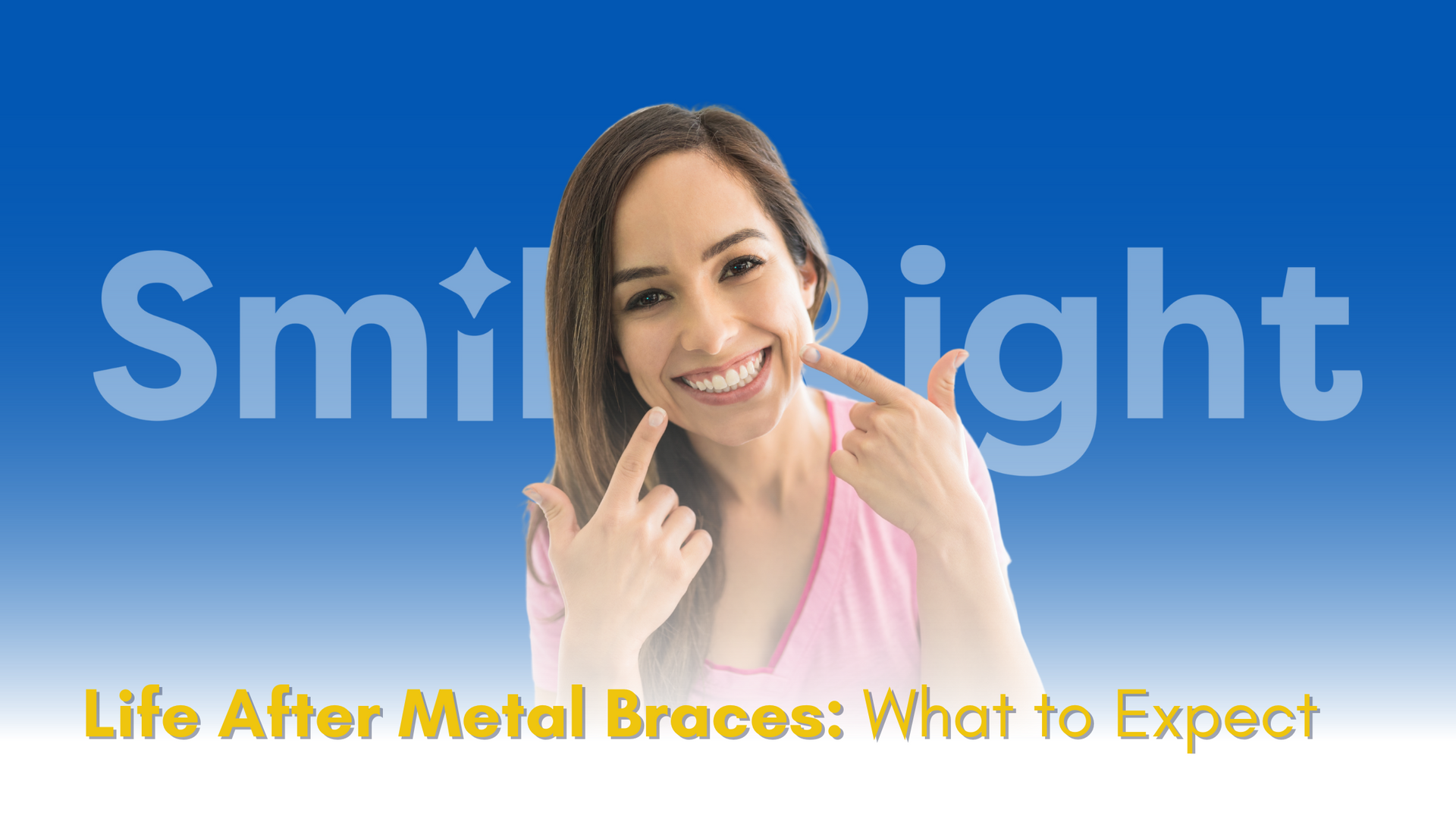 A woman is smiling and pointing at her teeth.