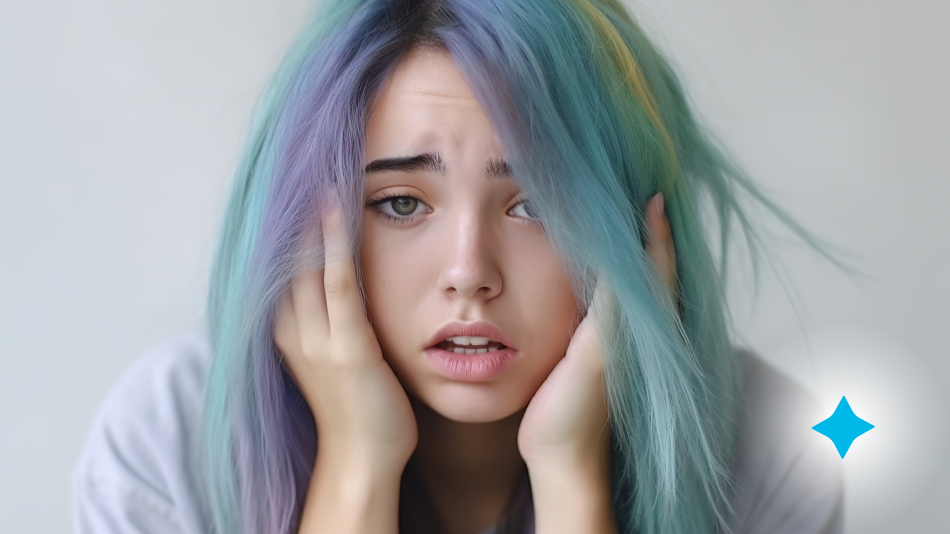 A woman with blue and purple hair is covering her ears with her hands.
