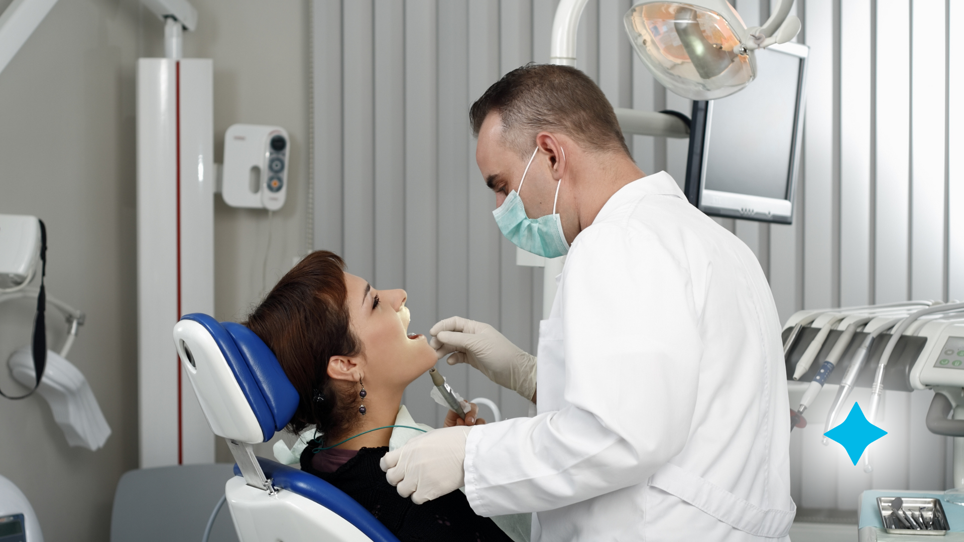 A dentist is examining a woman 's teeth in a dental office.
