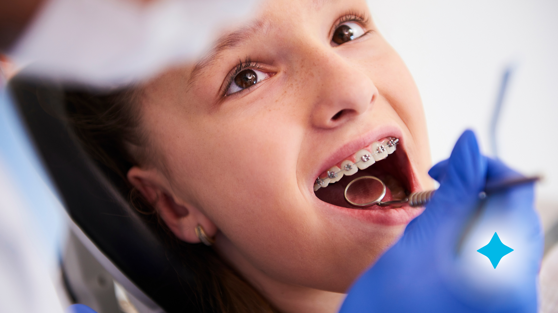 Orthodontist looking at patient