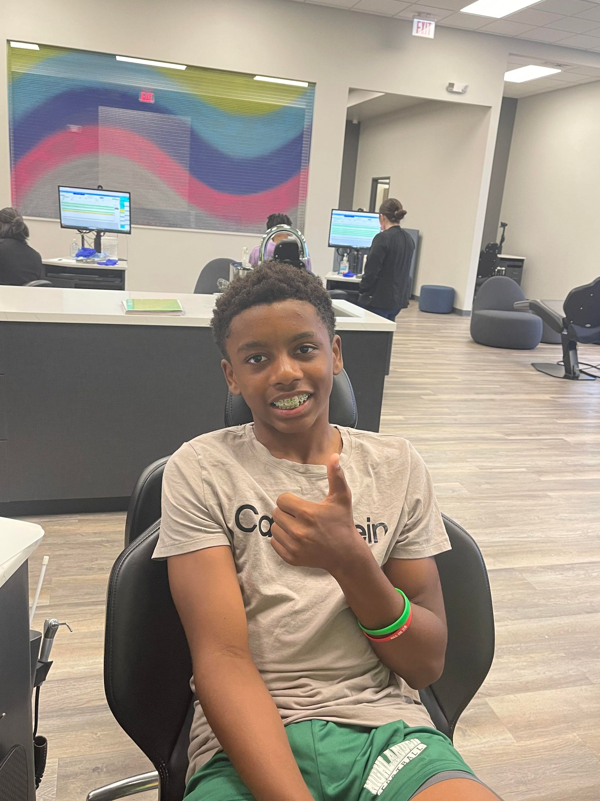 boy smiling with braces