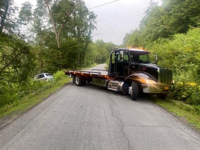 Side View of Black Tow Truck — Deposit, NY — Wheeler’s Collision