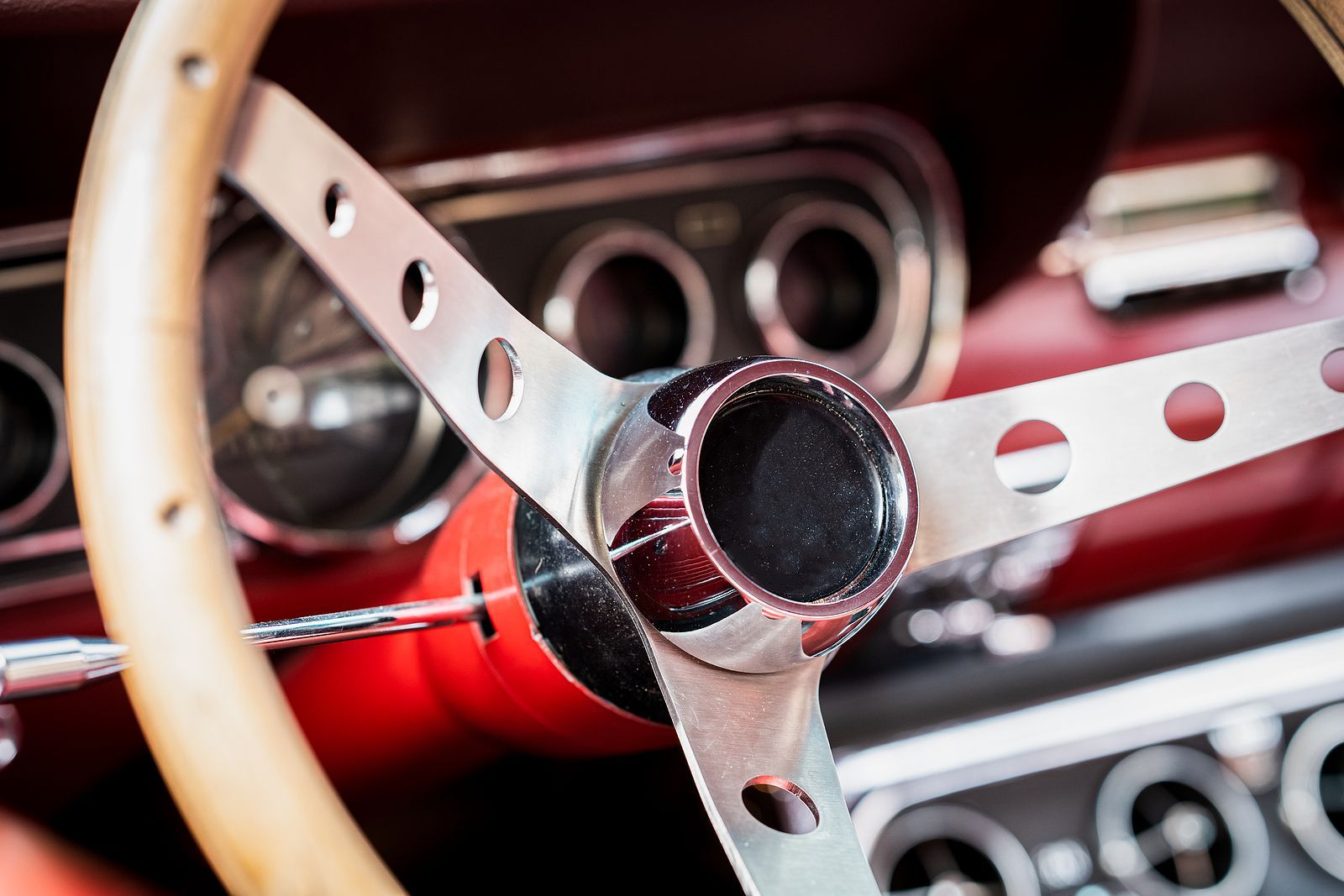 A close up of a steering wheel in a car
