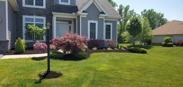 Large House With Lush Green Lawn — Dunkirk, NY — North County Landscaping