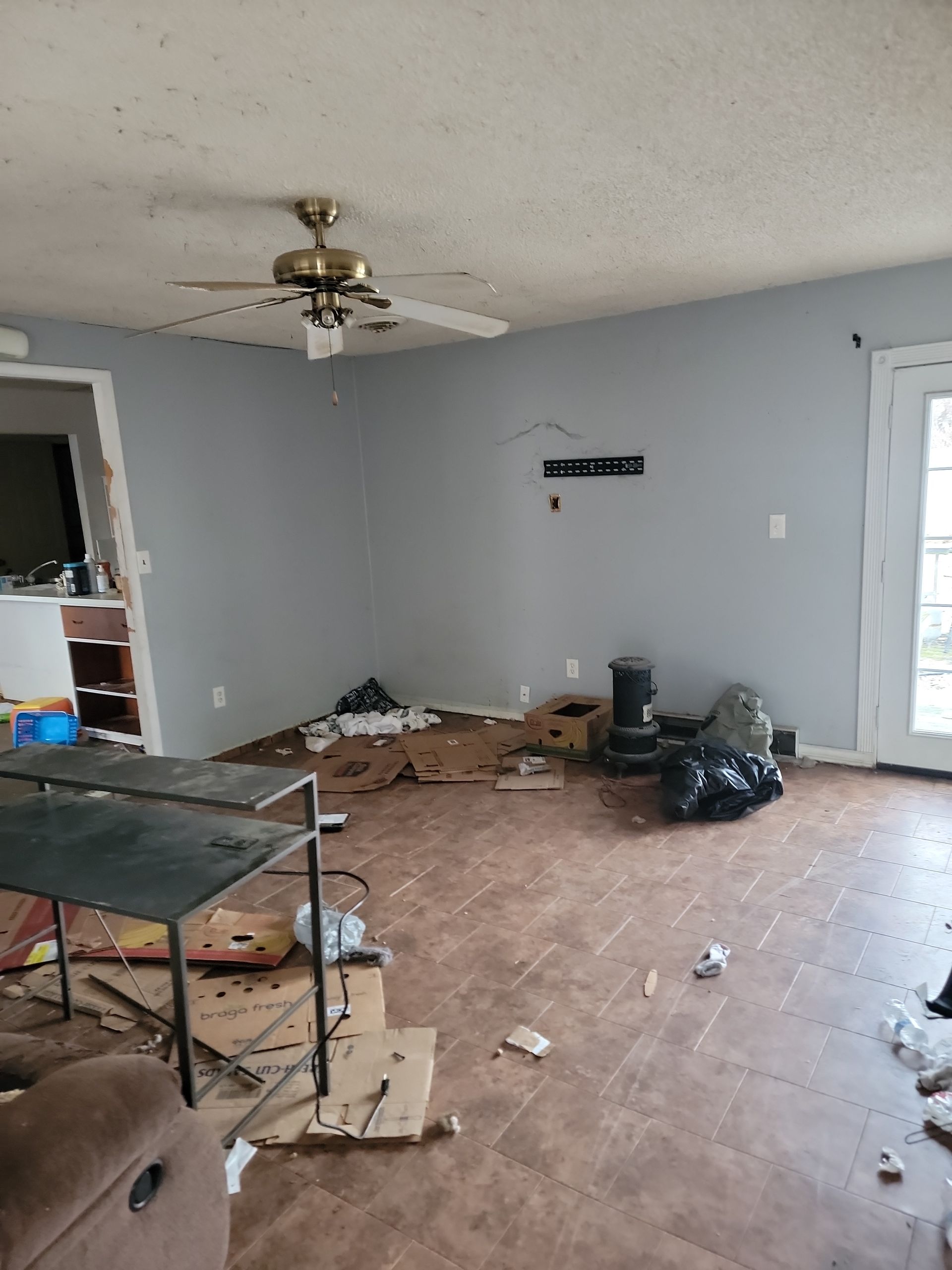 Dirty Room With Boxes And Tables — North Vernon, IN — Mullins & Family Outdoor