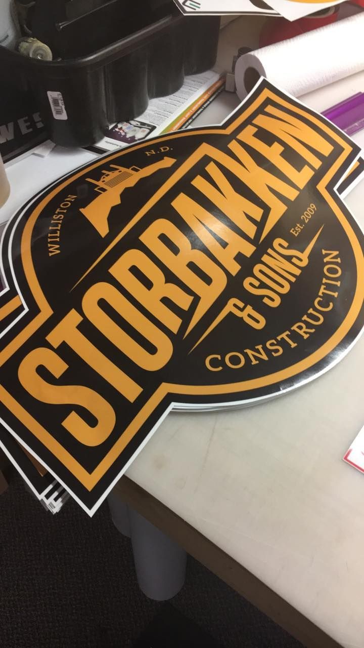 A black and yellow sign that says storm broken 6 sons construction