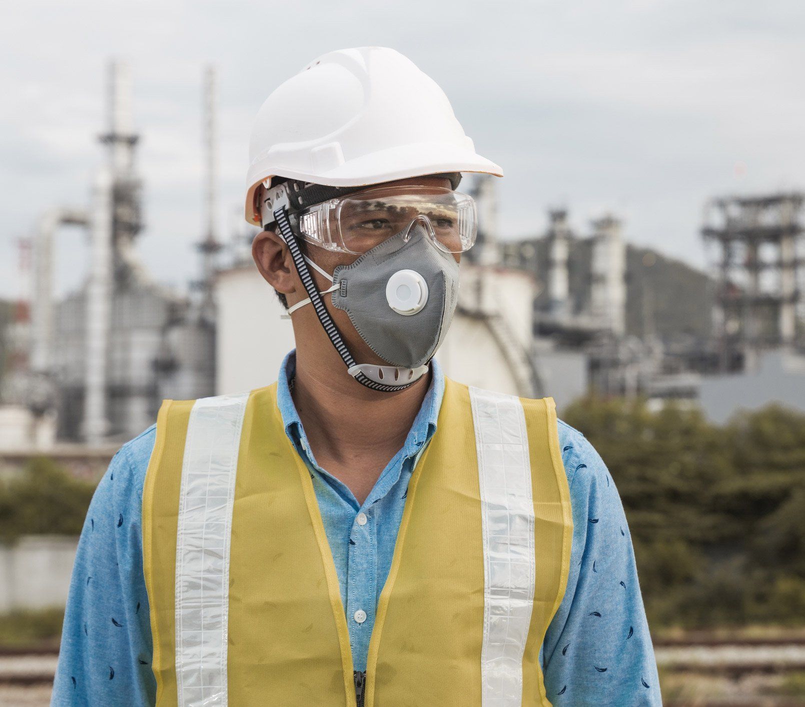 Man Wearing Protective Hat And Mask — Odessa, TX — TTC Safety Inc Man Wearing Protective Hat And Mask — Odessa, TX — TTC Safety Inc