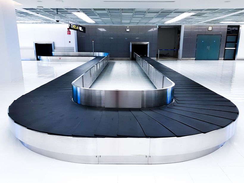 An empty baggage claim area at an airport