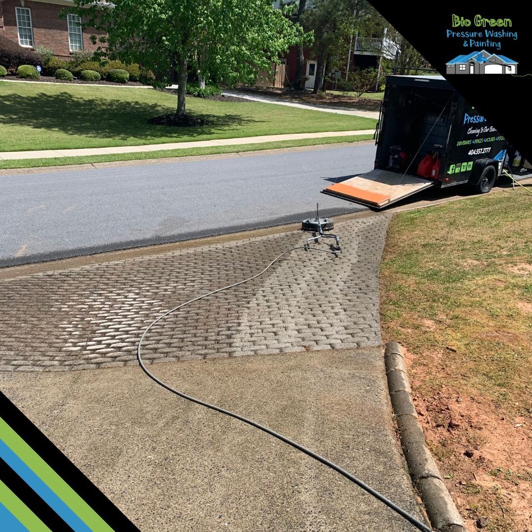 Portable ramp from a truck to a sidewalk curb cut on a suburban street, with a cable across the path