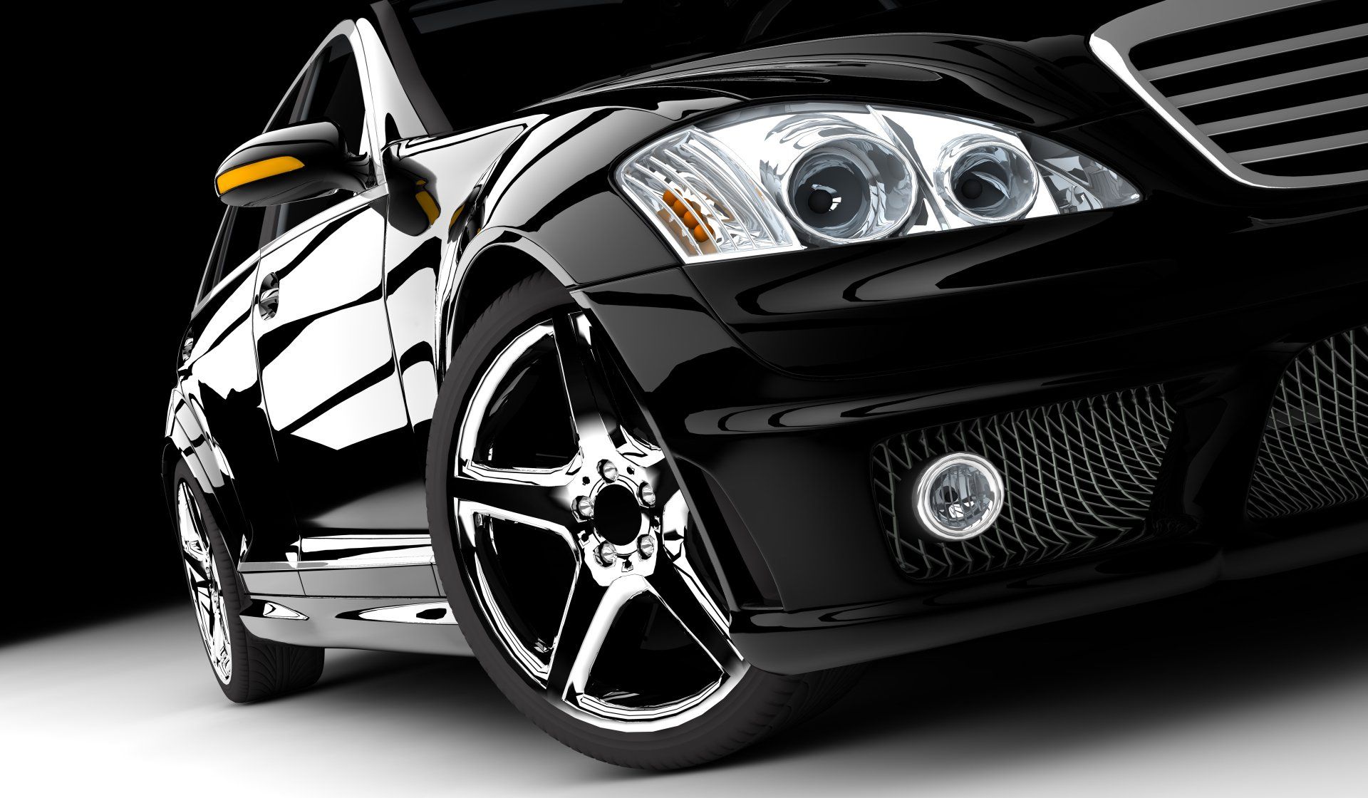 A close up of a black car on a white surface