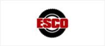 Logo of the word ESCO in white text on a red rectangle. The rectangle is inside of a black tire graphic.