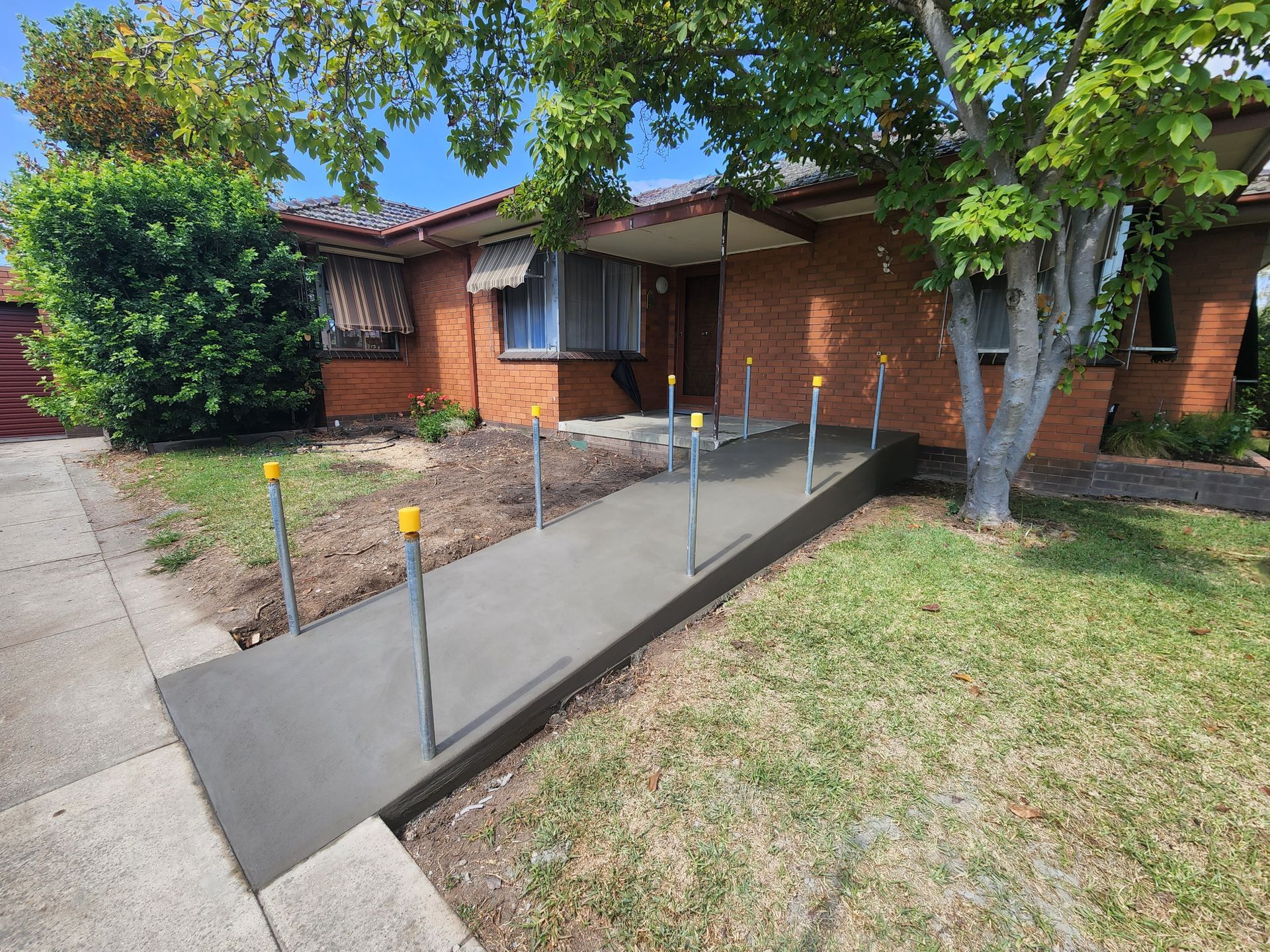 A brick house with a ramp in front of it