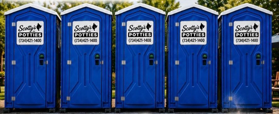 Portable toilet in a row outdoor.