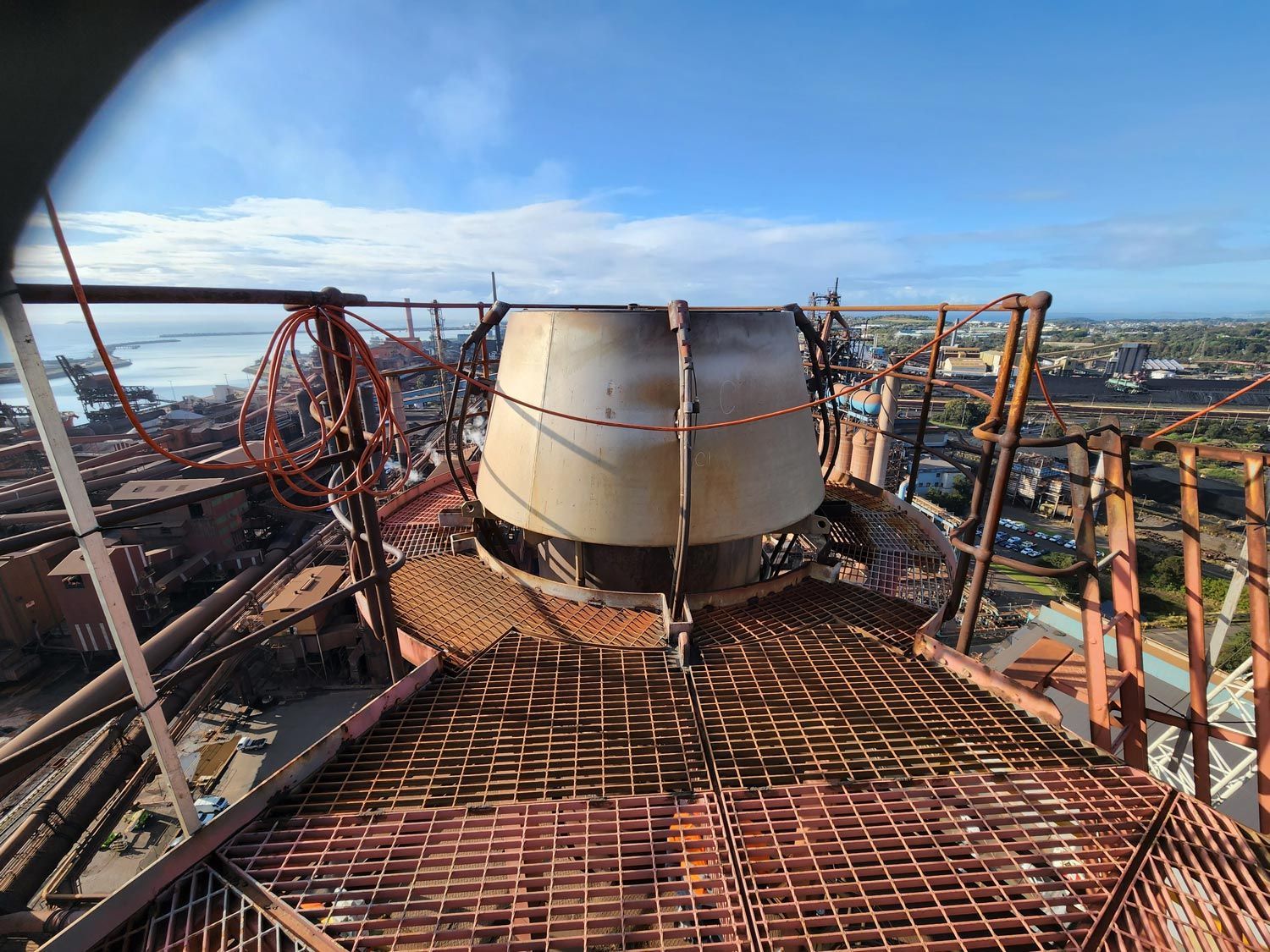 a large metal structure is being built on top of a building