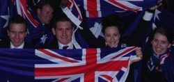 a group of people are holding the australian flag