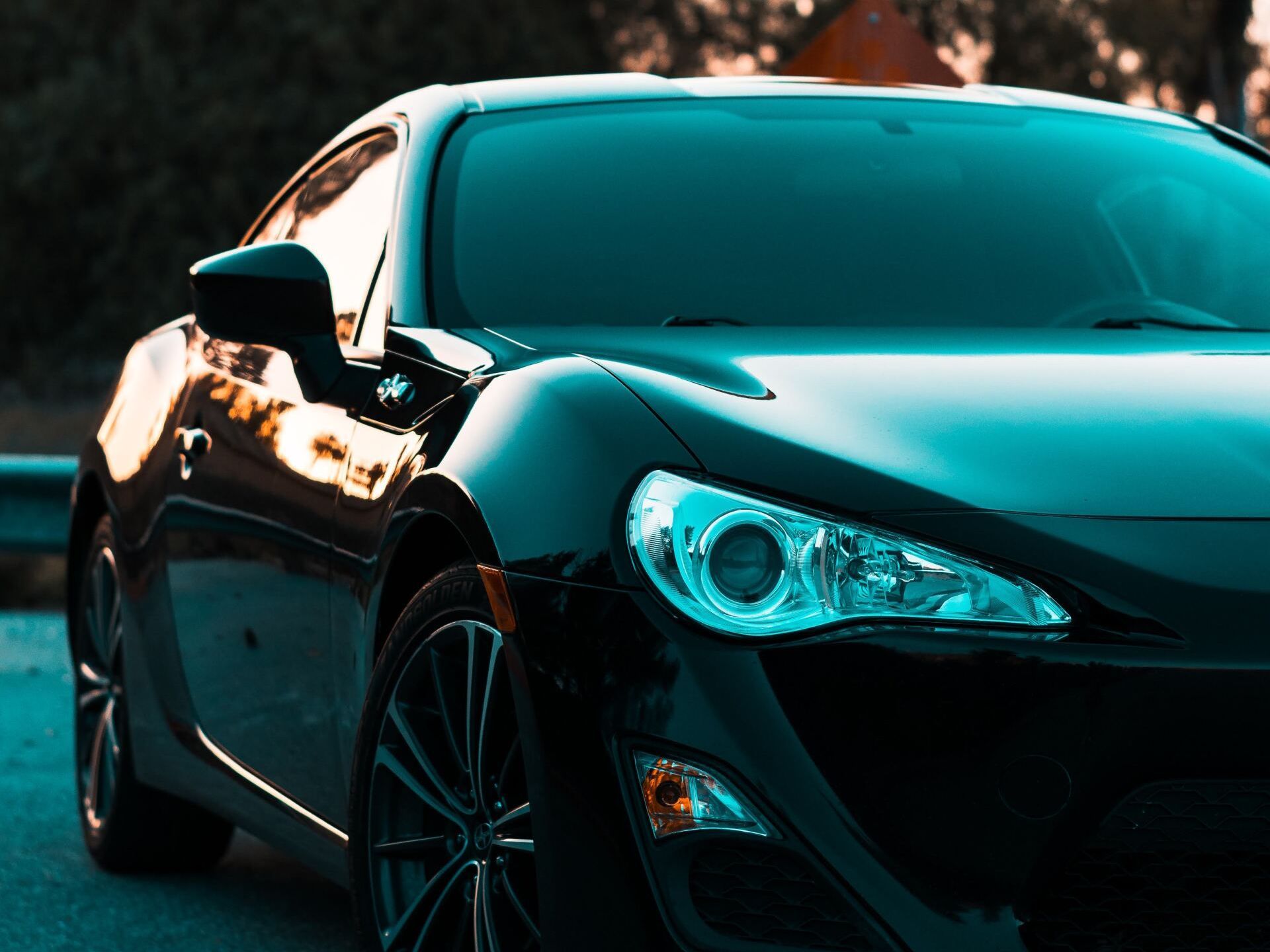 Nice Car pic A black sports car is parked on the side of the road.