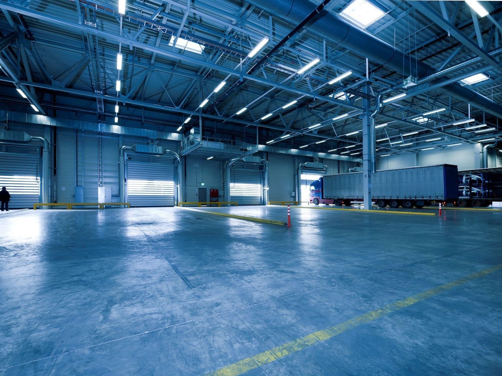 Warehouse pic A large warehouse with a lot of trucks in it