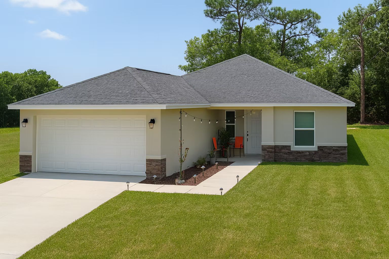 Single-story suburban house with a two-car garage, gray roof, front porch, and green lawn