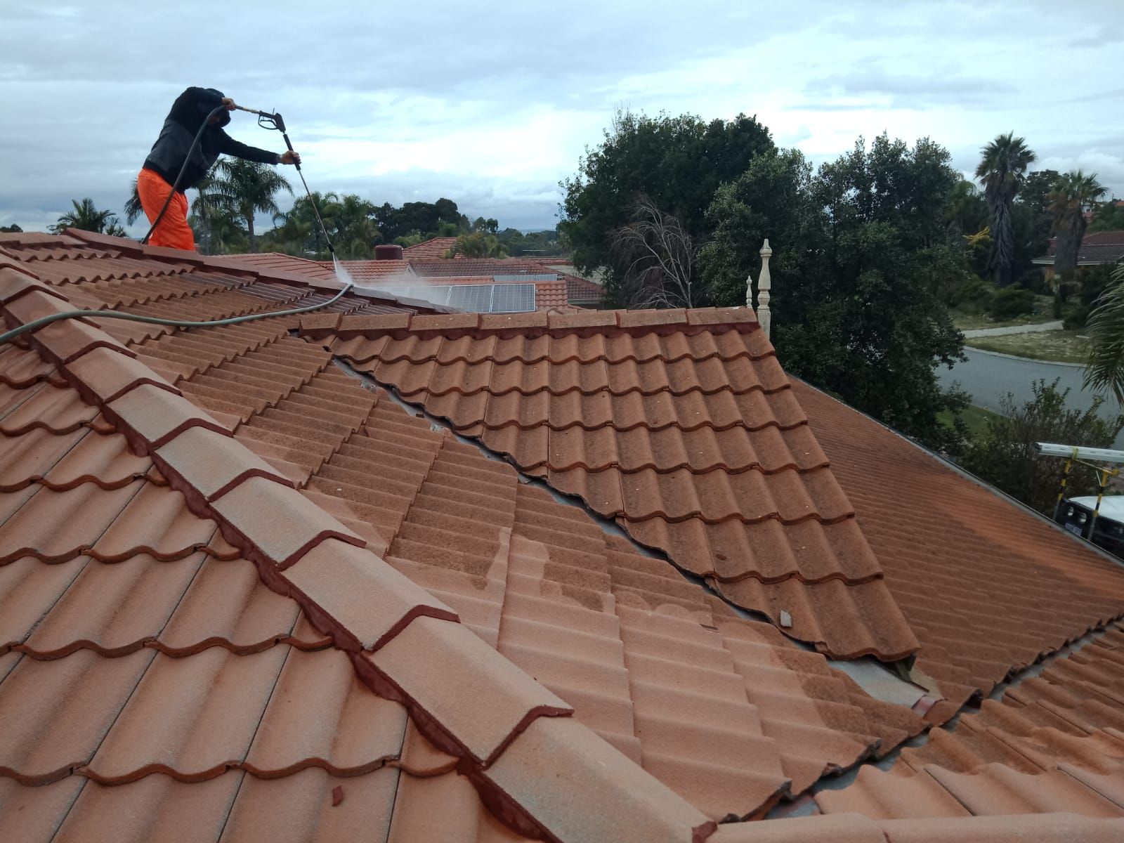 Man Cleaning Roof — Thornlie, WA — Noble Roof Restoration & Repairs