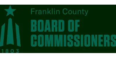 Franklin County Board of Commissioners logo in green and black with stylized monument and star