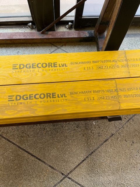 Steel Reinforcing Accessories Sitting on A Tiled Floor Next to A Window - Concrete Options Group in Gympie, QLD