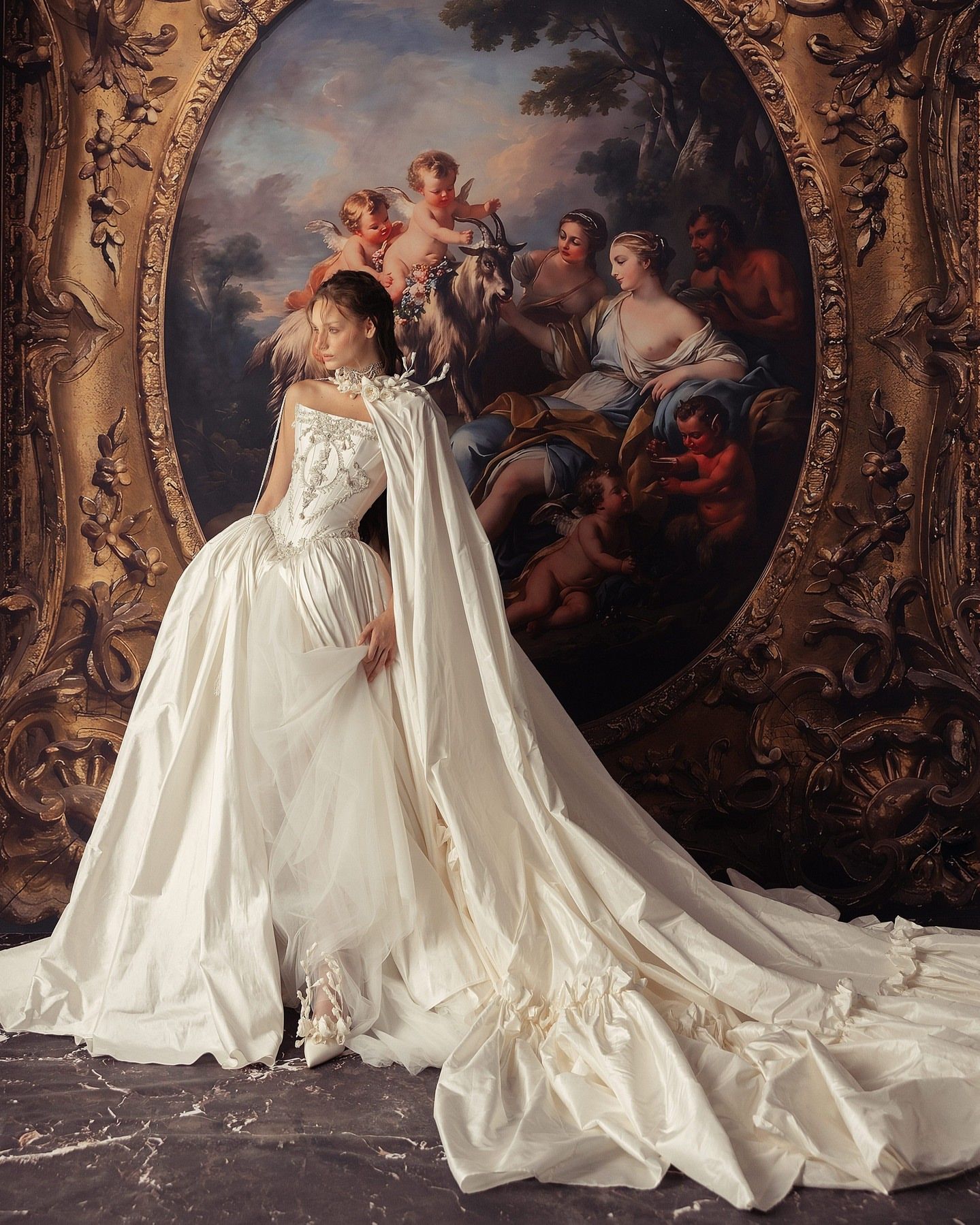 Bride in a white strapless gown posing in a minimalist room with soft natural light
