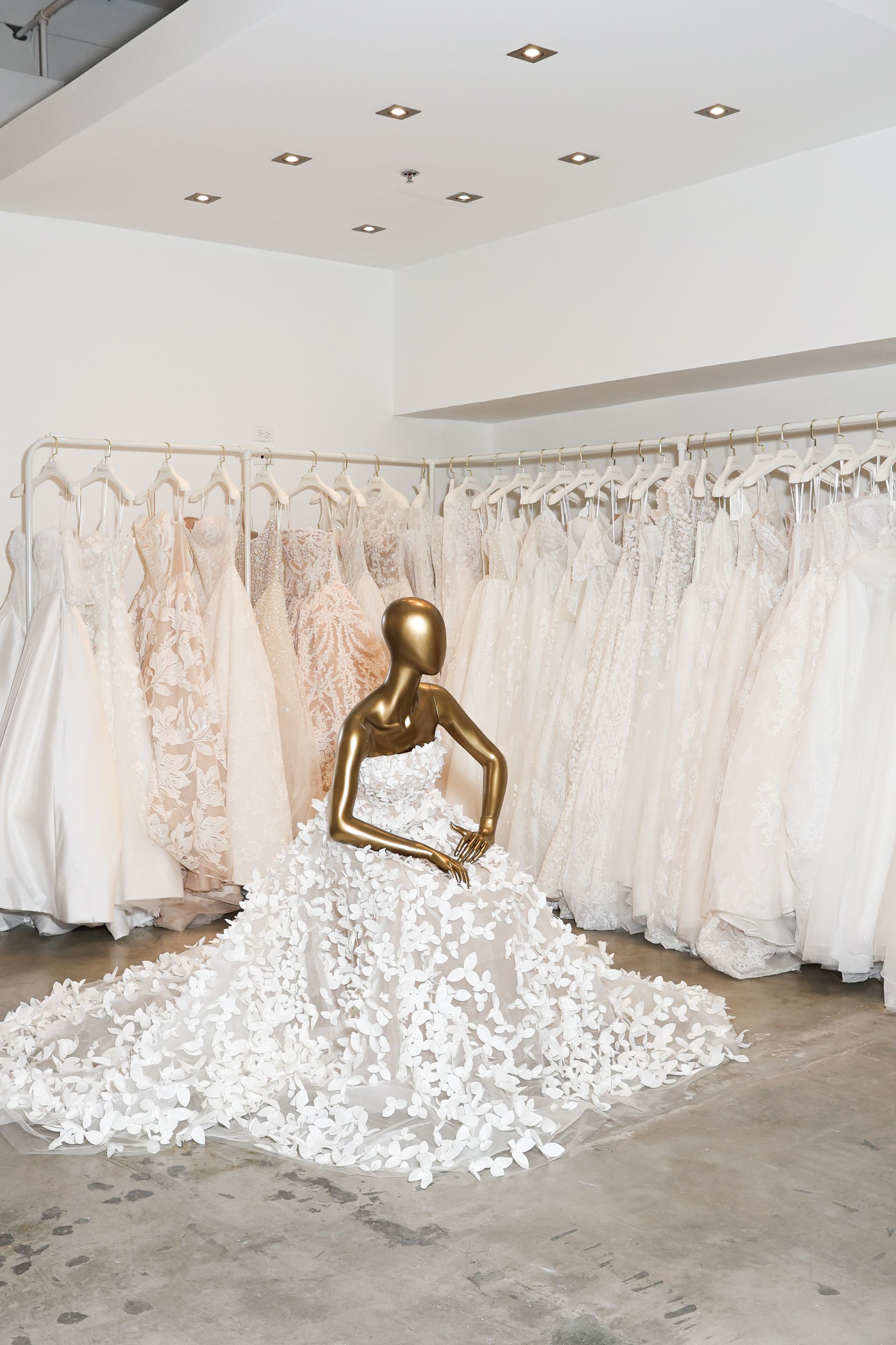 Wedding gown racks inside House Of Luxe Bridal Atelier located in Miami 