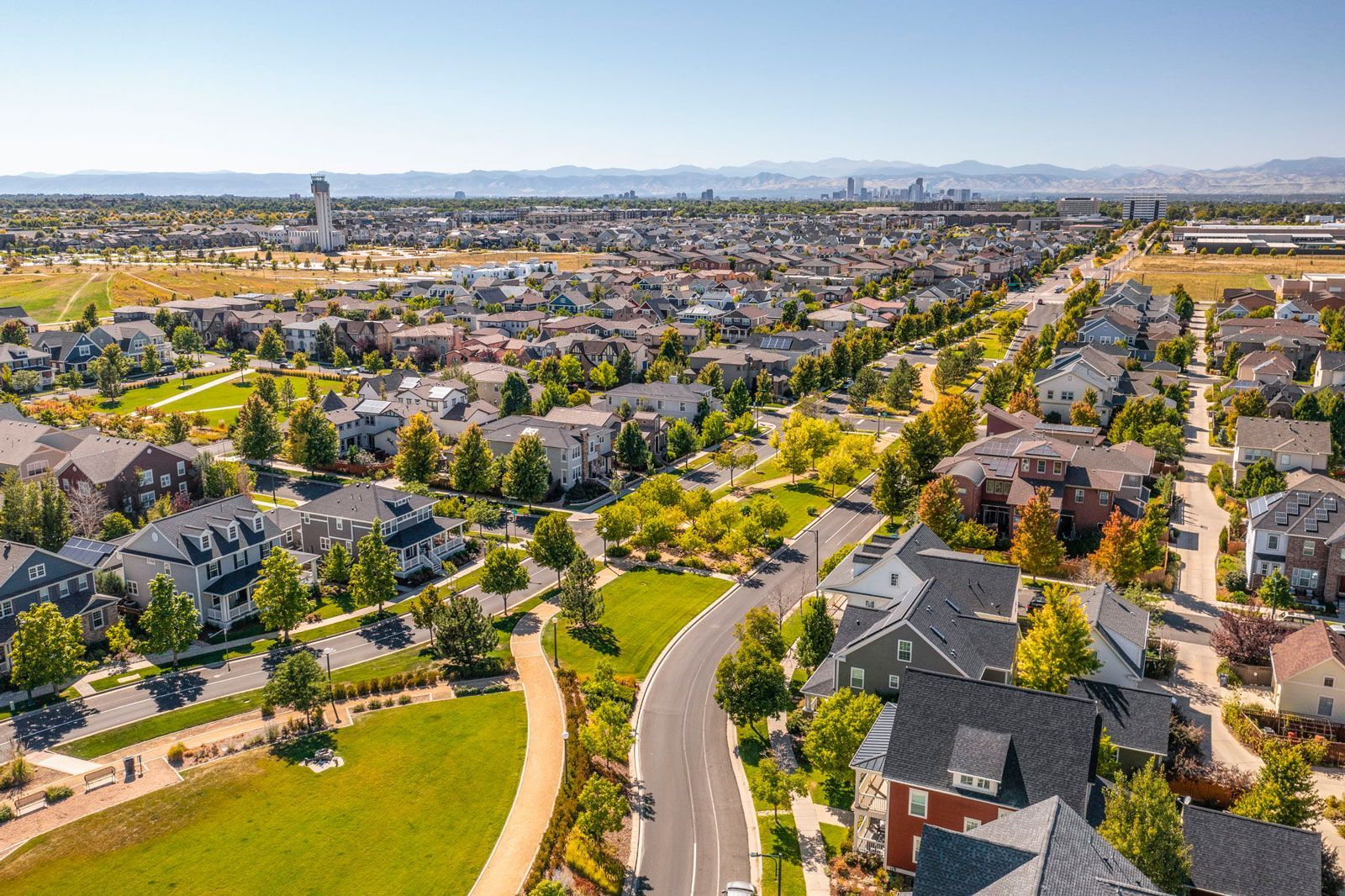 An aerial view of a residential area with lots of houses and trees.