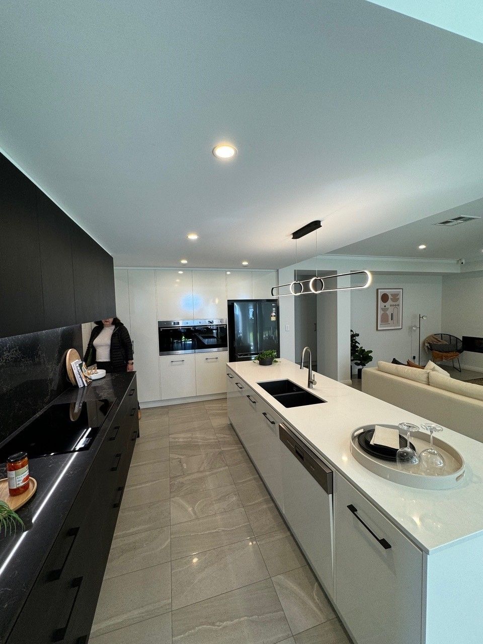 A kitchen with a large island and a sink