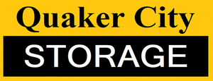 Logo for Quaker City Storage with the text in black and white against a yellow background.