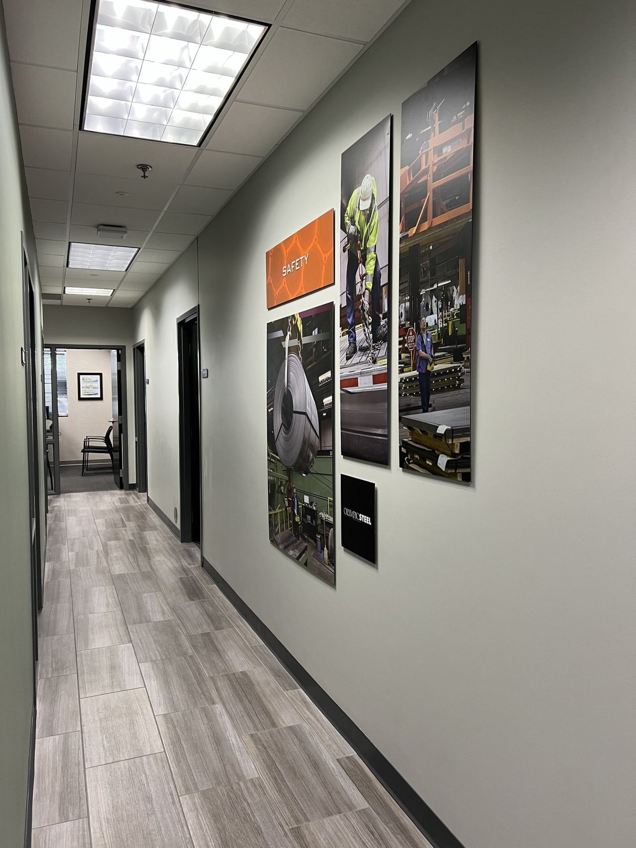 A long hallway with a lot of pictures on the wall.