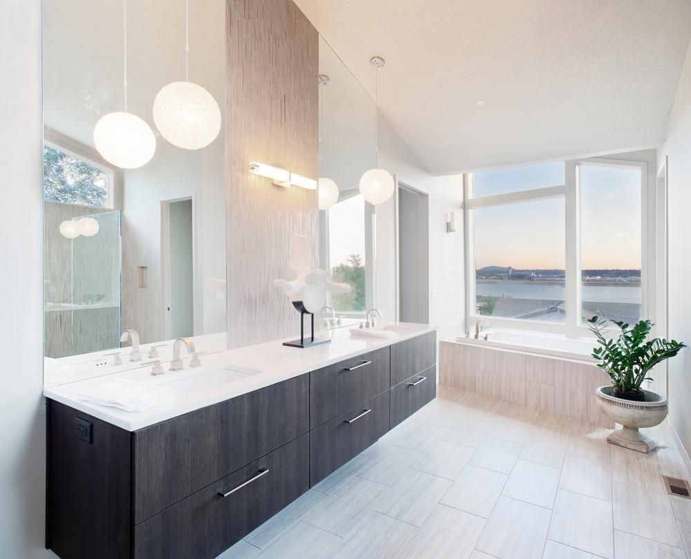 A Bathroom With Two Sinks, A Tub And A Large Mirror — Gold Coast City Plumbing In Helensvale, QLD
