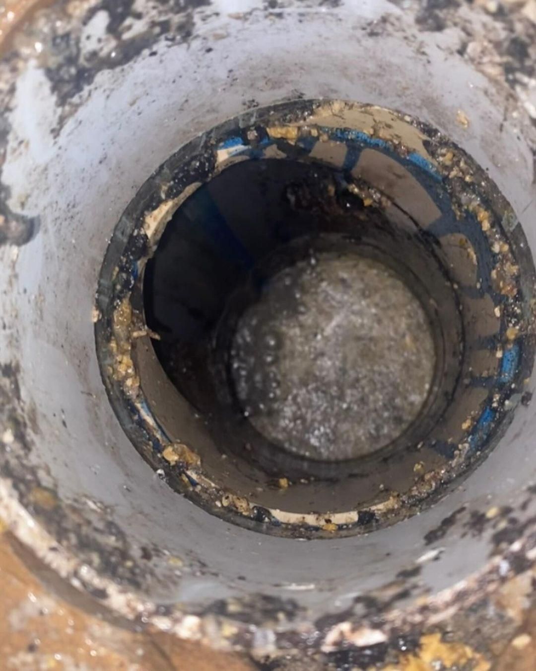 A Close Up Of A Dirty Hole In A Pipe — Gold Coast City Plumbing In Helensvale, QLD