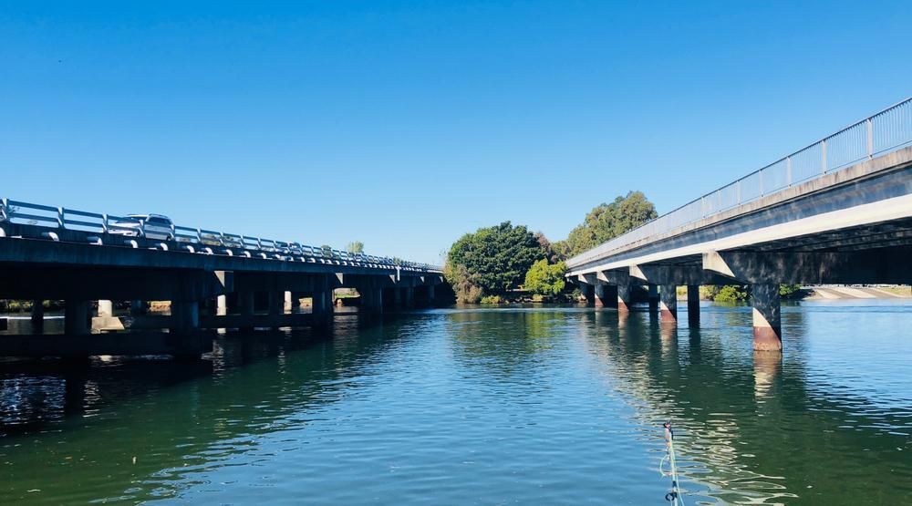 A Couple Of Bridges Over A Body Of Water — Gold Coast City Plumbing In Coomera, QLD