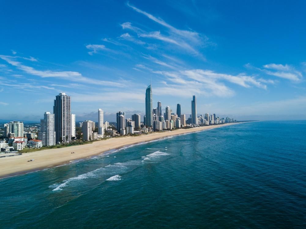 An Aerial View Of A City Skyline Overlooking The Ocean — Gold Coast City Plumbing In Gold Coast, QLD