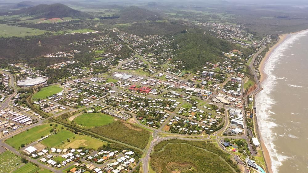 An Aerial View Of A Small Town Next To The Ocean — Gold Coast City Plumbing In Pimpama, QLD