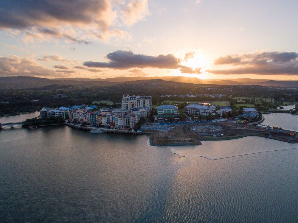 An Aerial View of a City Surrounded by Water at Sunset — Better Stone in Gold Coast, QLD